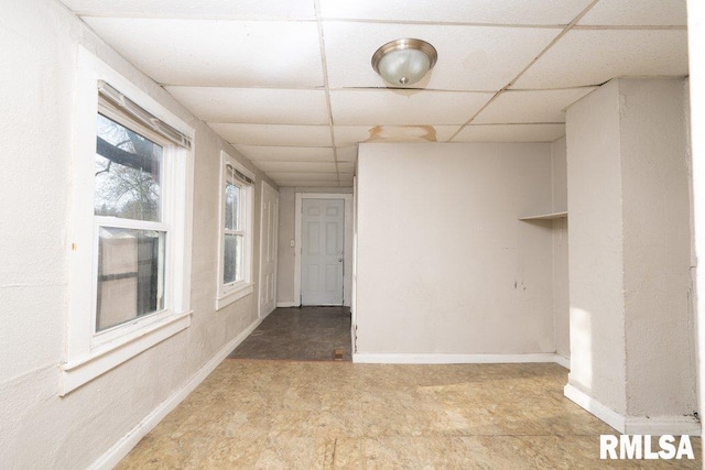 empty room with a drop ceiling