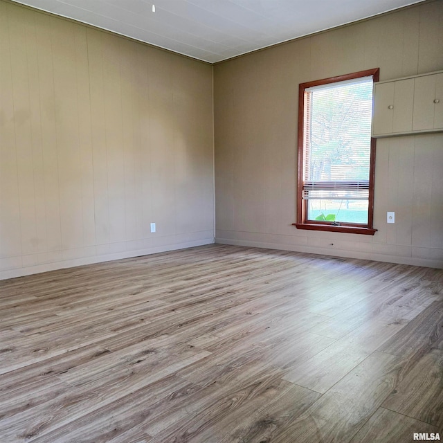 unfurnished room with light hardwood / wood-style flooring