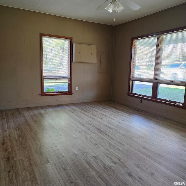 unfurnished room featuring ceiling fan and light hardwood / wood-style floors