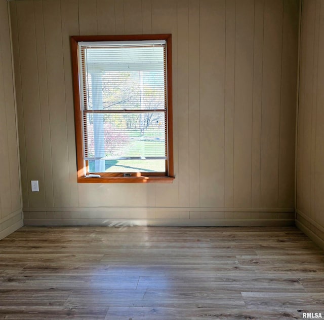 spare room with light hardwood / wood-style flooring