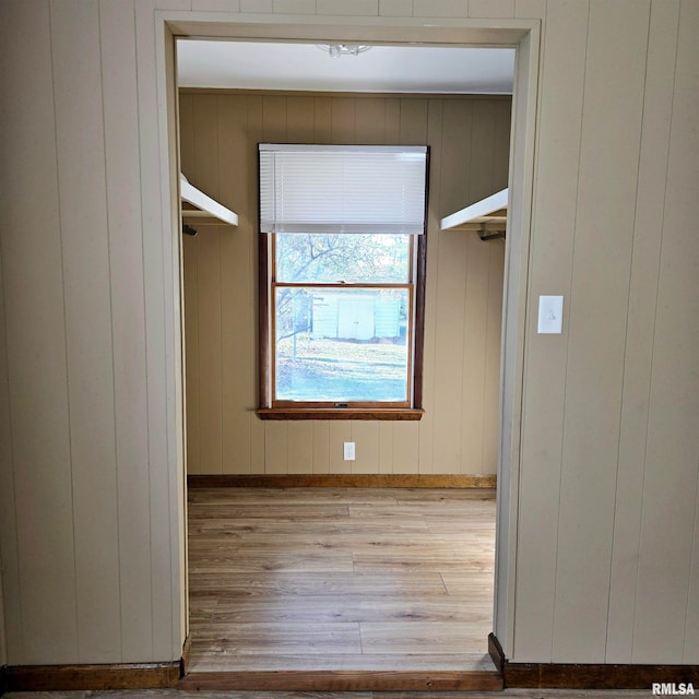 spacious closet with light hardwood / wood-style flooring