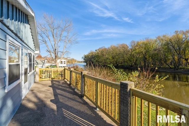 wooden terrace with a water view