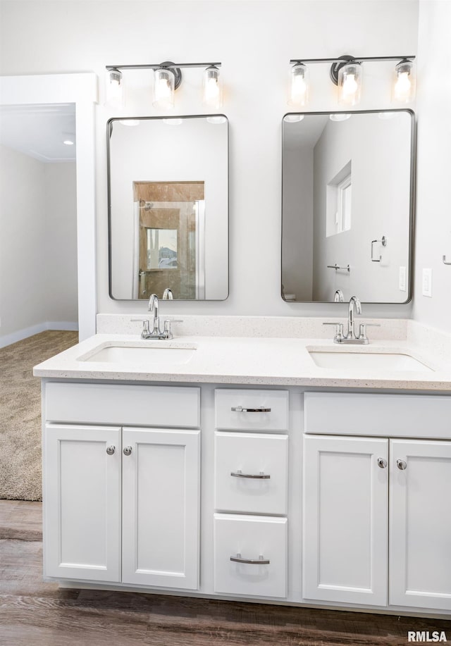 bathroom featuring vanity and wood-type flooring