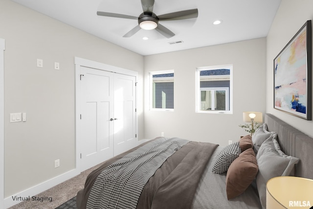 bedroom with carpet, a closet, and ceiling fan