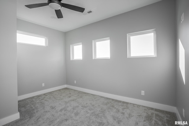 carpeted empty room featuring ceiling fan