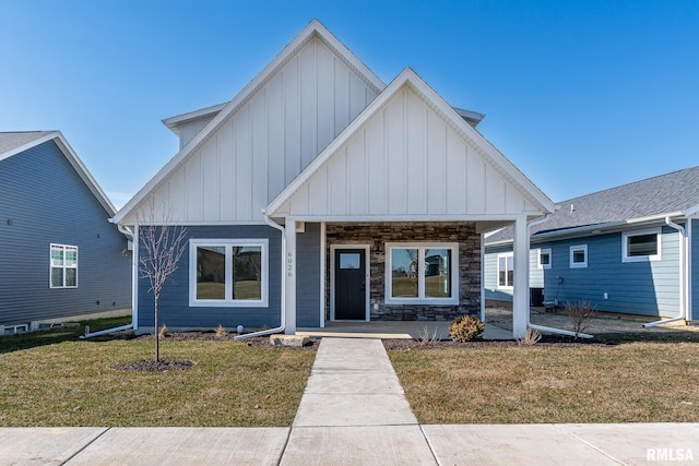 view of front of house with a front lawn and a porch