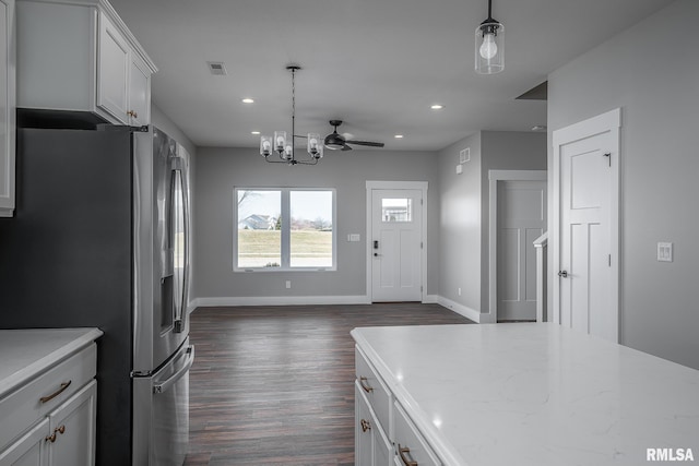 kitchen with pendant lighting, white cabinets, dark hardwood / wood-style floors, and stainless steel refrigerator with ice dispenser