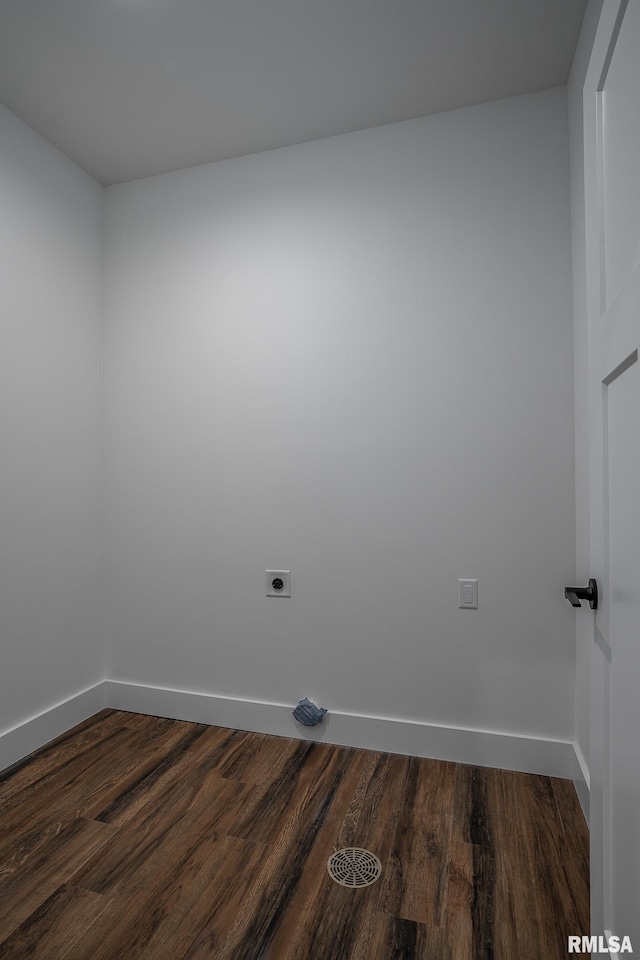 laundry room featuring hookup for an electric dryer and dark wood-type flooring