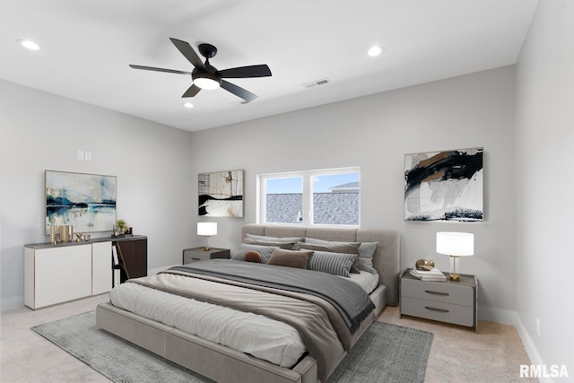 bedroom featuring ceiling fan and light colored carpet