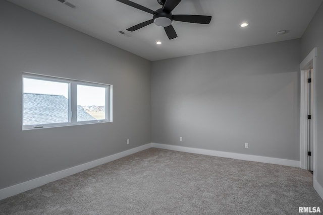 carpeted empty room with ceiling fan and lofted ceiling