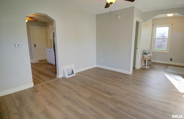 unfurnished room with ceiling fan and light hardwood / wood-style floors