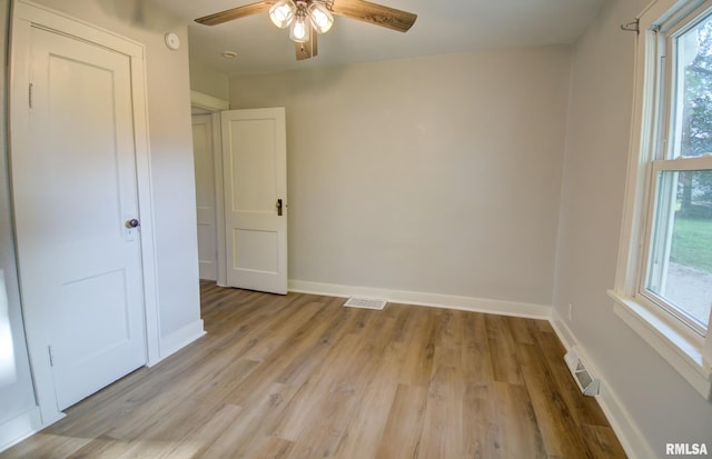 unfurnished bedroom with ceiling fan and light hardwood / wood-style flooring