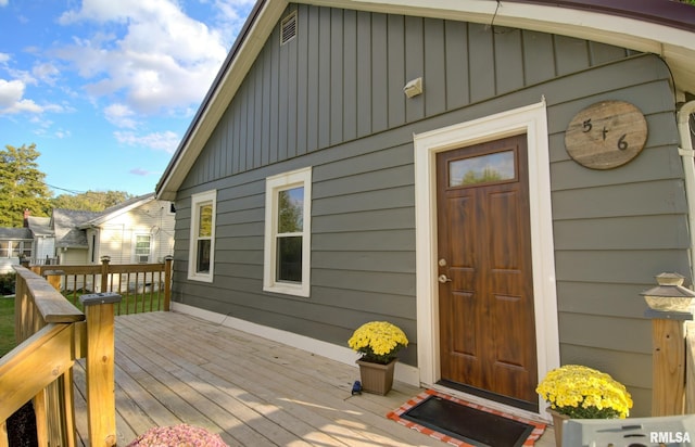 doorway to property featuring a wooden deck