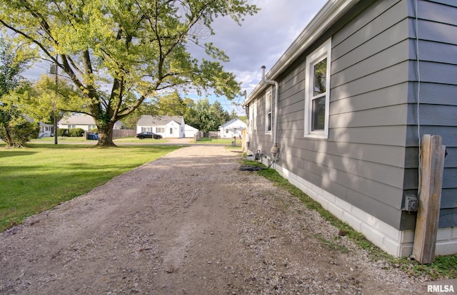 view of side of property featuring a yard