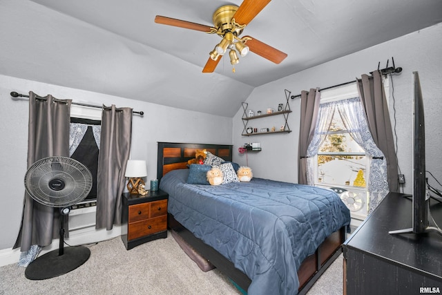 carpeted bedroom featuring vaulted ceiling and ceiling fan