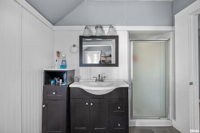 bathroom with vanity, an enclosed shower, and lofted ceiling