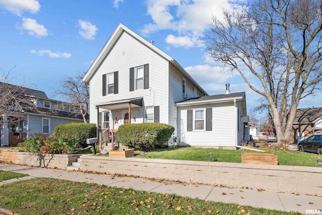 view of property with a front lawn