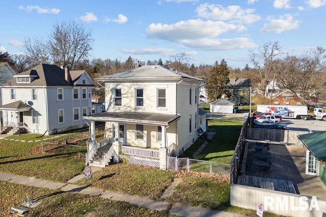 view of front facade with a porch and a front yard