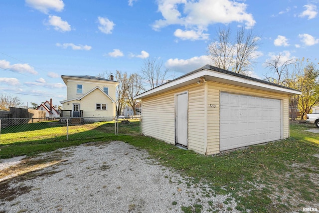 garage featuring a yard