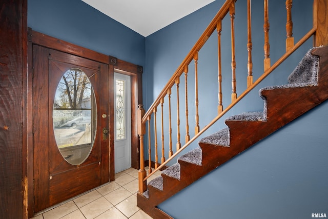 entryway with light tile patterned floors