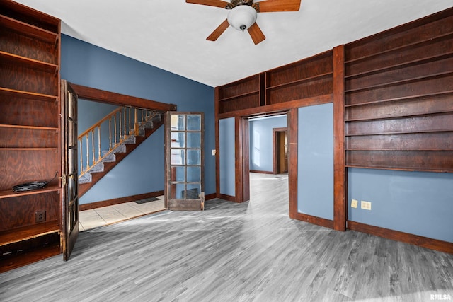 spare room with ceiling fan, light hardwood / wood-style floors, and lofted ceiling