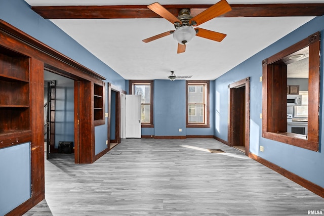 unfurnished room featuring ceiling fan and light wood-type flooring