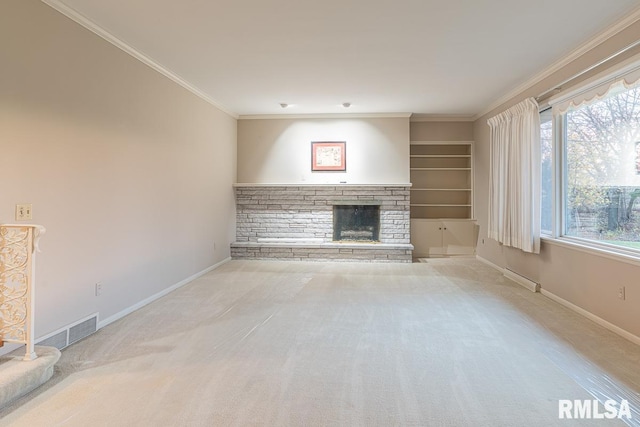 unfurnished living room with built in shelves, light carpet, and ornamental molding