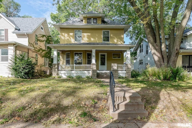 view of front facade featuring a porch and a front lawn