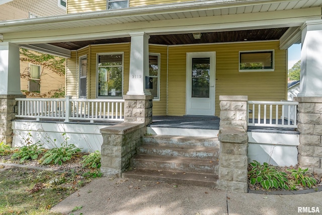 entrance to property with a porch