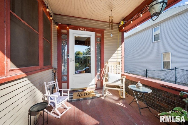 property entrance featuring covered porch