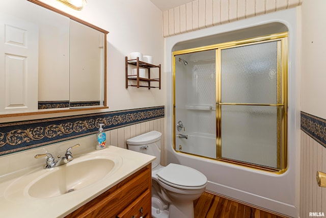 2115 Weaver Rd, Herrin, IL 62948 - full bathroom with shower / bath combination with glass door, vanity, toilet, and hardwood / wood-style floors