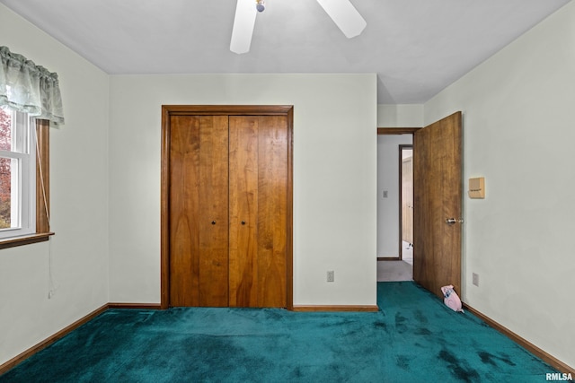 unfurnished bedroom featuring carpet flooring, ceiling fan, and a closet