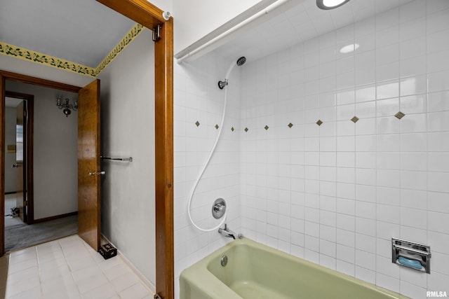 bathroom featuring tile patterned flooring and tiled shower / bath combo