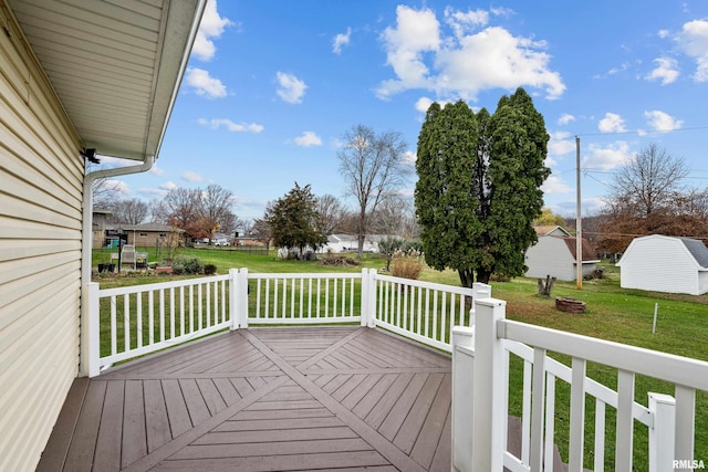 wooden deck featuring a yard