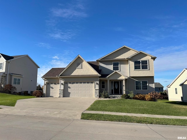 view of front facade featuring a front lawn and a garage