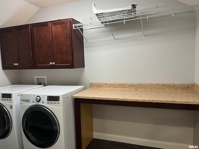 laundry area with cabinets, independent washer and dryer, and a textured ceiling