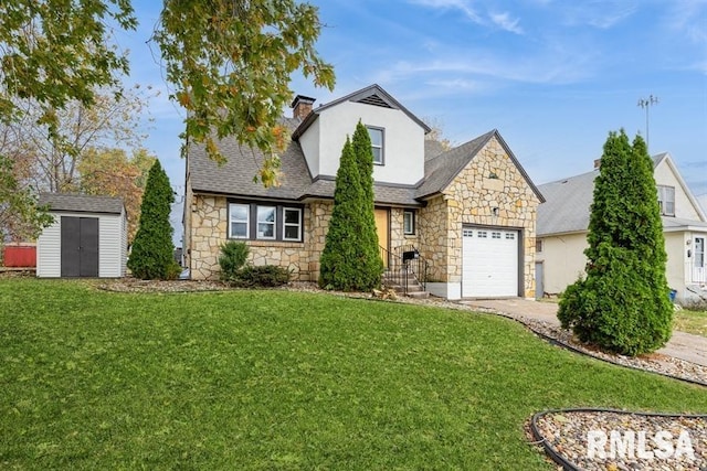 view of front of home with a front lawn, a garage, and a storage unit