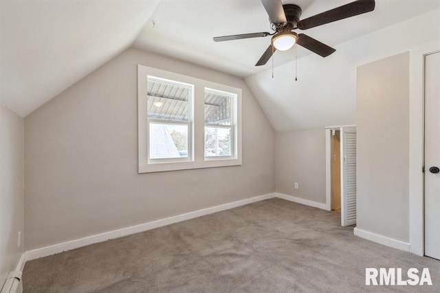 bonus room featuring light carpet, ceiling fan, vaulted ceiling, and a baseboard heating unit