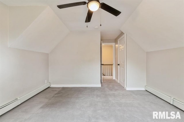 bonus room with ceiling fan, light colored carpet, lofted ceiling, and a baseboard heating unit