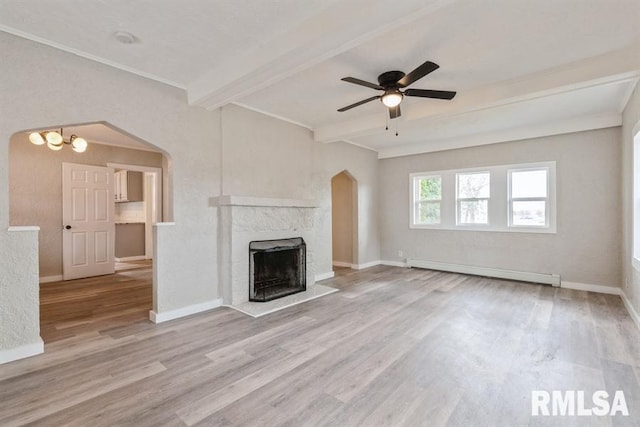 unfurnished living room with beam ceiling, a high end fireplace, a baseboard radiator, and light hardwood / wood-style floors