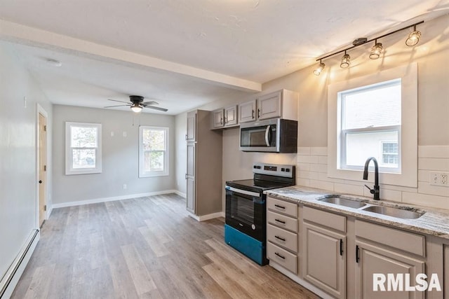 kitchen with backsplash, a baseboard heating unit, sink, black range with electric cooktop, and light hardwood / wood-style floors