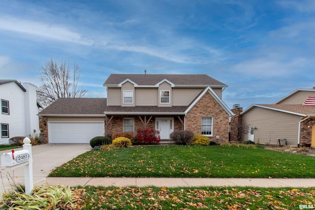 view of front property featuring a front yard and a garage