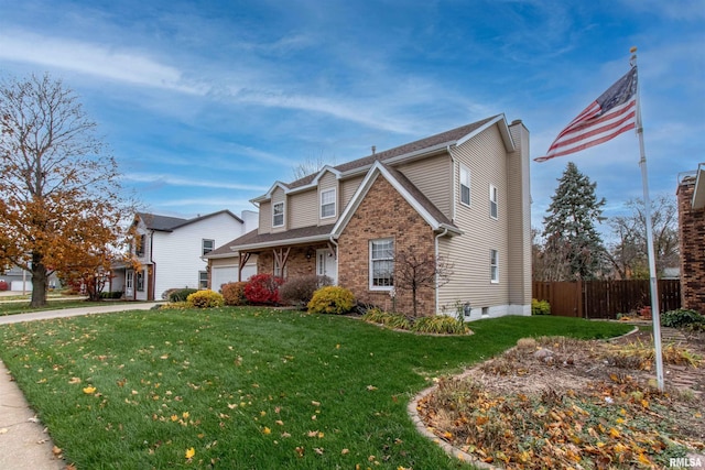 front facade featuring a front lawn and a garage