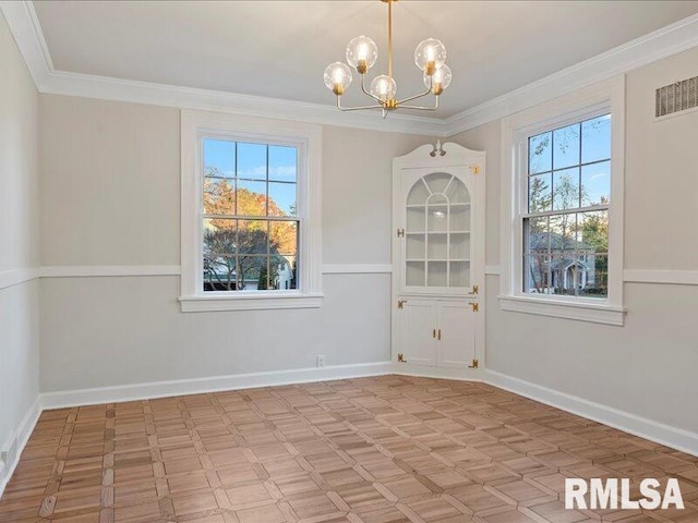 unfurnished dining area with baseboards, visible vents, ornamental molding, and a notable chandelier