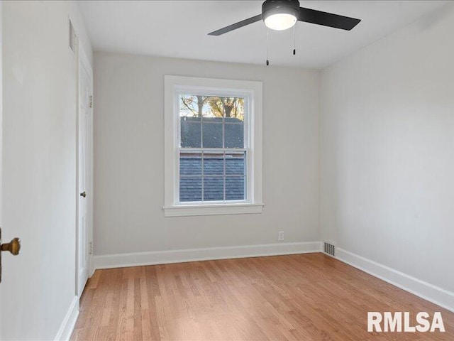 unfurnished room with light wood-type flooring and ceiling fan