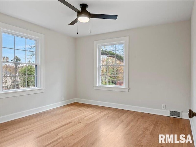 unfurnished room featuring ceiling fan and light wood-type flooring