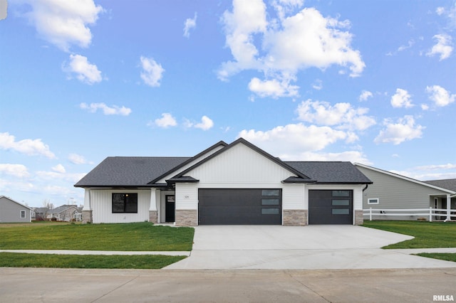 view of front facade with a front yard and a garage