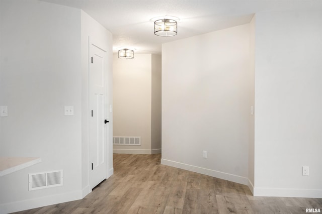 hallway with light wood-type flooring