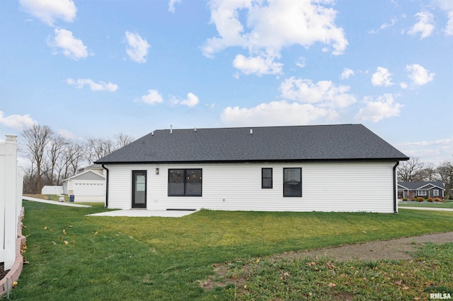 back of property featuring a yard and a patio area