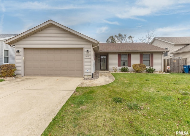 ranch-style house featuring a front lawn and a garage